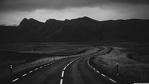 Monochrome Highway Winding Through Dramatic Mountain Landscape HD wallpaper