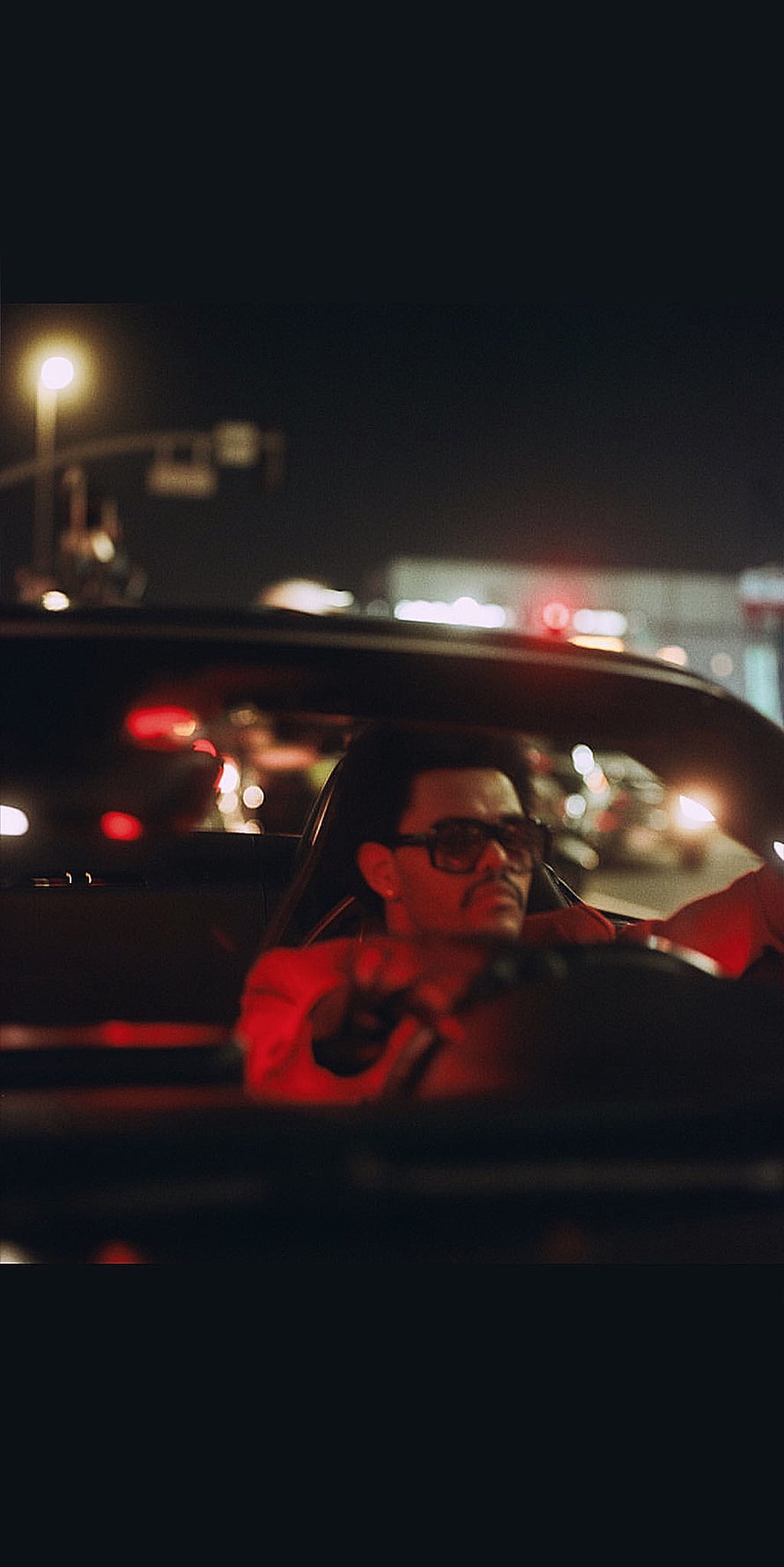 The Weeknd Driving at Night in a Red Jacket with Sunglasses HD phone wallpaper