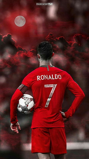 Cristiano Ronaldo in Portugal Red Kit Holding Football Under Dramatic Moonlit Sky HD phone wallpaper