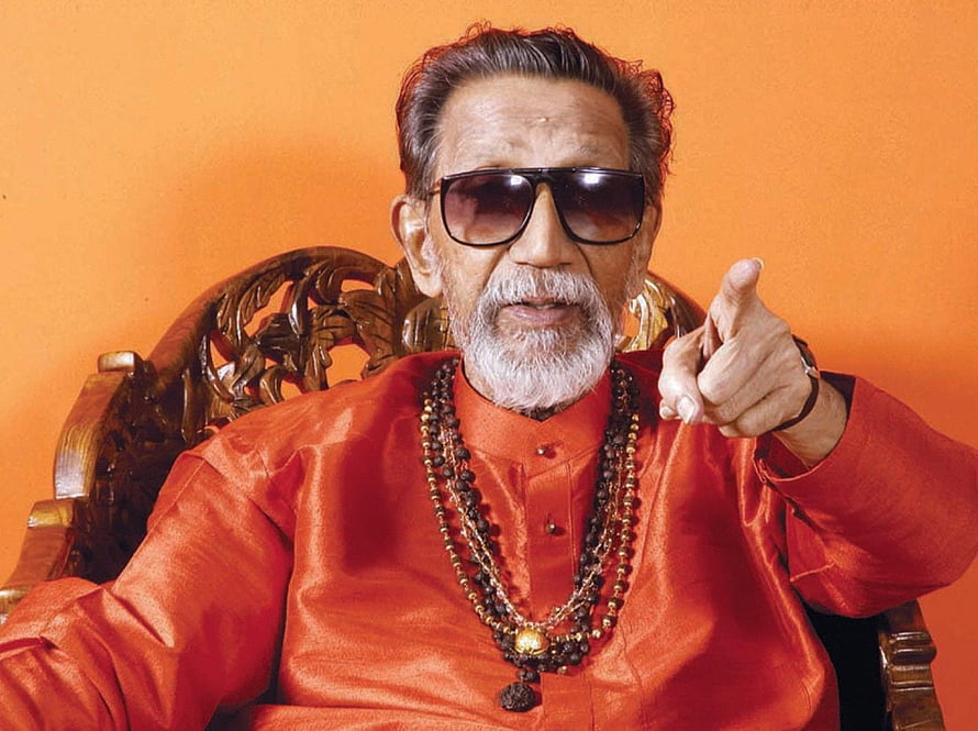 Bal Thackeray Portrait in Red Kurta with Sunglasses and Beaded Necklace HD wallpaper