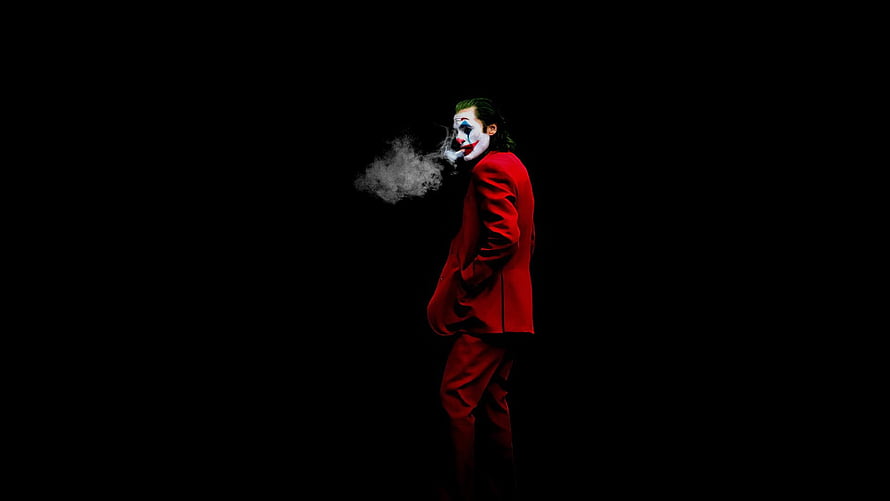 Joker in Red Suit Smoking Against Black Background HD wallpaper