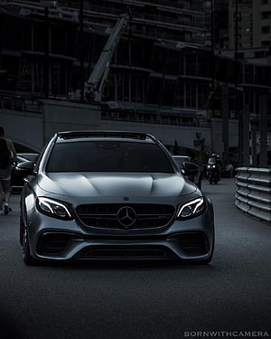Mercedes-AMG E63 S Estate in Matte Grey on an Urban Street at Dusk HD phone wallpaper