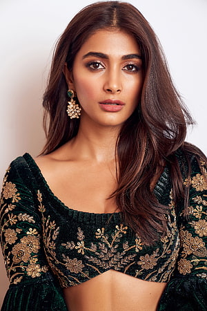 Pooja Hegde in an elegant dark green velvet blouse with intricate gold floral embroidery and statement earrings HD phone wallpaper