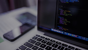 Laptop Displaying CSS Code With Smartphone On Desk HD wallpaper