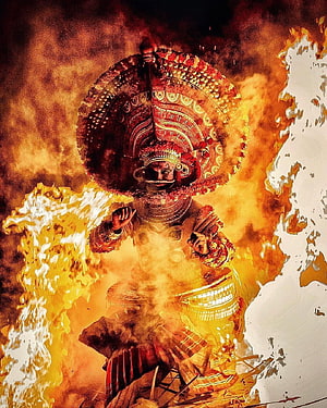Dramatic Theyyam Performance with Elaborate Headdress and Fire HD phone wallpaper