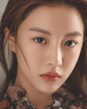Close-up portrait of a young woman with soft natural makeup and floral top, Go Yoon Jung HD phone wallpaper