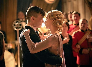 Tommy Shelby and Grace Sharing an Intimate Dance in Period Ballroom Setting HD wallpaper