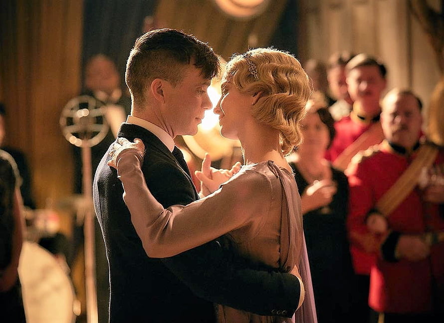Tommy Shelby and Grace Sharing an Intimate Dance in Period Ballroom Setting HD wallpaper