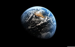 Planet Earth Viewed From Space With North America And Swirling Clouds Against Black Void HD wallpaper