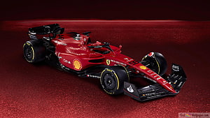 Ferrari Formula 1 Race Car on Red Track Surface with Sponsor Logos HD wallpaper