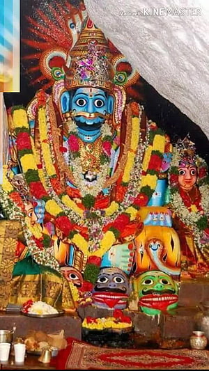 Mallanna Swamy Temple Deity Adorned With Vibrant Flower Garlands And Traditional Offerings HD phone wallpaper