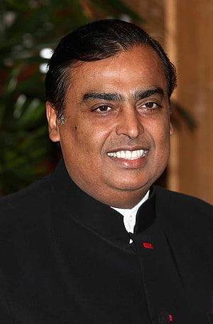 Mukesh Ambani in a black bandhgala jacket with a warm smile and formal portrait HD phone wallpaper