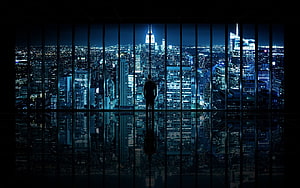 Silhouette of a businessman standing in a high-rise office overlooking a sprawling city skyline at night, 3 Traders, day trading HD wallpaper