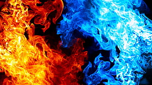 Vibrant Orange and Blue Flames Colliding on a Dark Background HD wallpaper