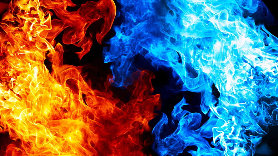 Vibrant Orange and Blue Flames Colliding on a Dark Background HD wallpaper