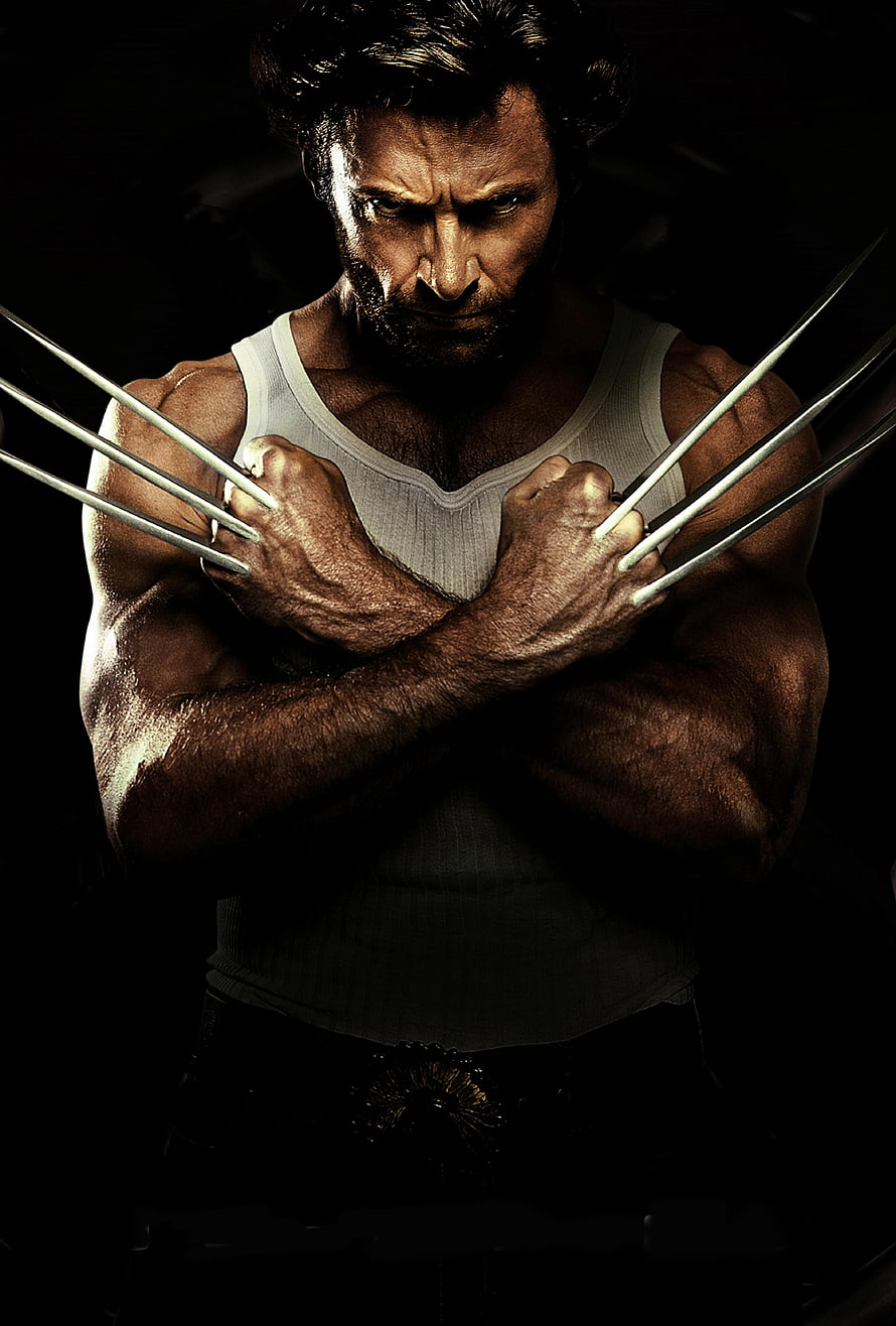 Wolverine with extended adamantium claws in a dark cinematic portrait HD phone wallpaper