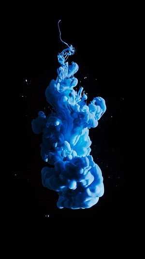 Abstract Blue Ink Cloud Rising in Water Against Black Background HD phone wallpaper