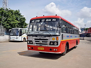 Red and Silver KSRTC Ashok Leyland Bus Parked in Depot HD wallpaper