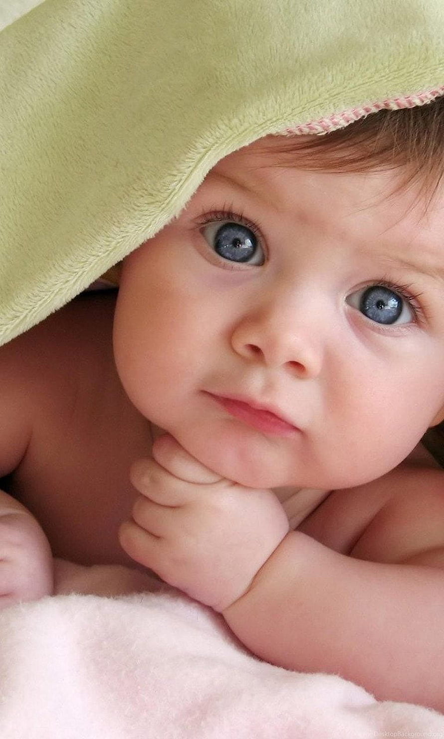 Adorable Baby Boy With Blue Eyes Peeking From Under A Soft Green Blanket HD phone wallpaper