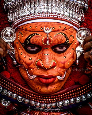 Traditional Kathakali Dance Makeup Portrait with Intricate Silver Headdress and Face Paint HD phone wallpaper