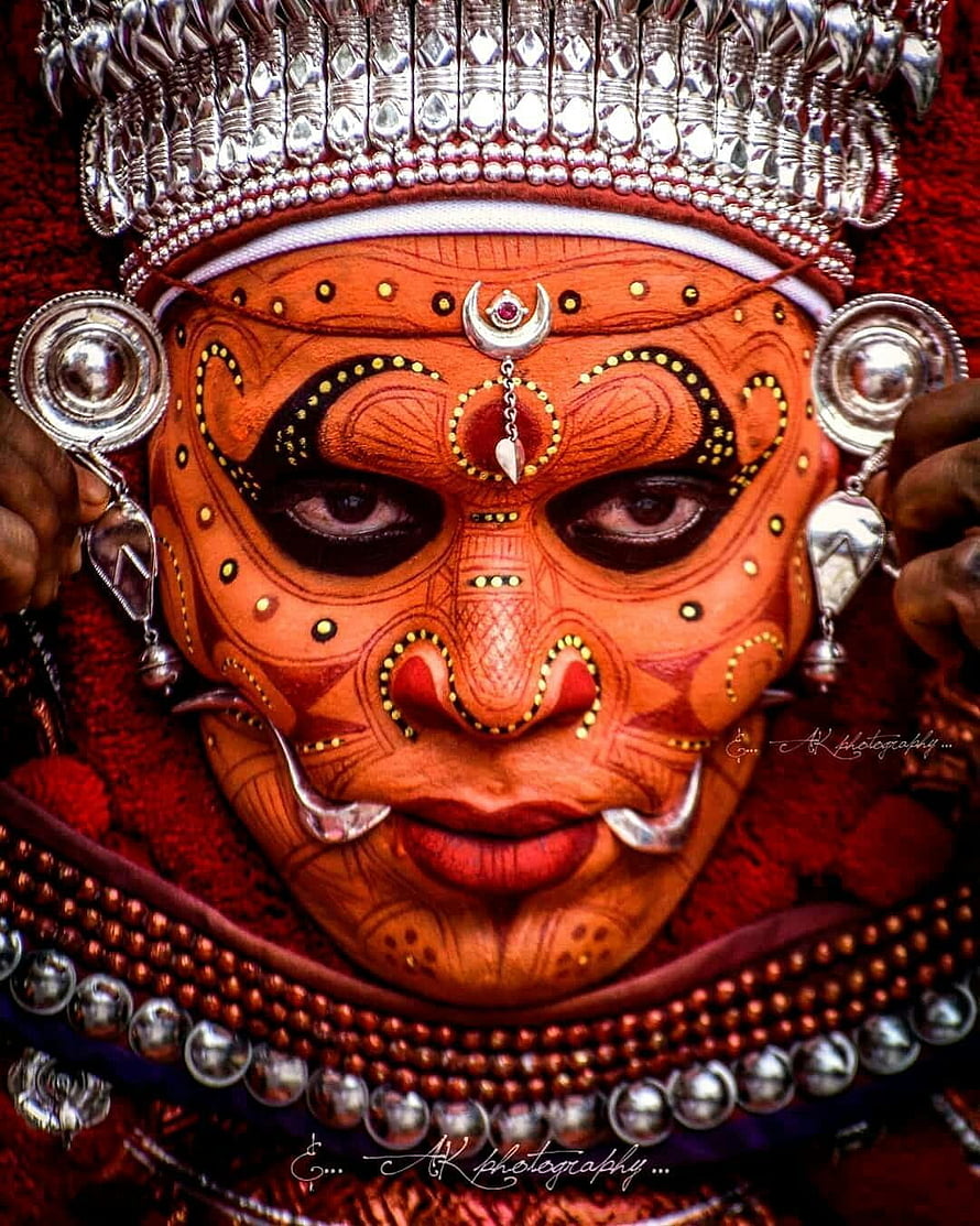 Traditional Kathakali Dance Makeup Portrait with Intricate Silver Headdress and Face Paint HD phone wallpaper