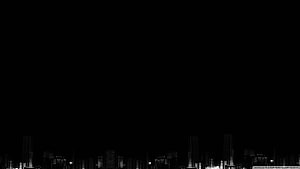 Minimalist Black Night Sky Over Distant City Skyline Silhouette HD wallpaper
