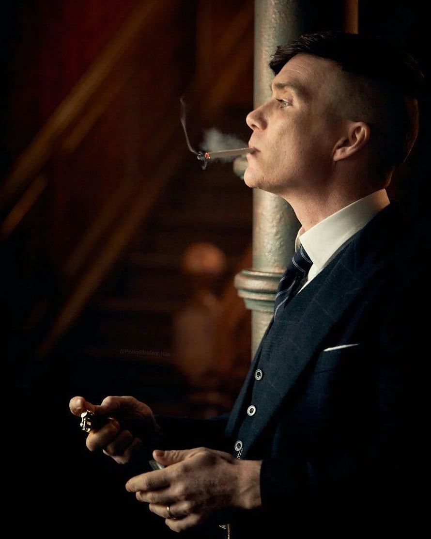 Tommy Shelby smoking cigarette in dark suit from Peaky Blinders series HD phone wallpaper