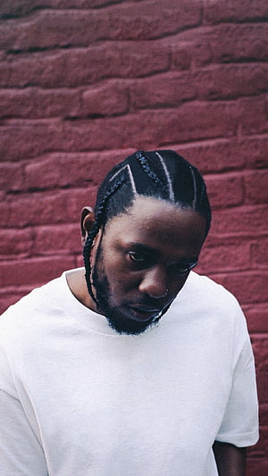 Kendrick Lamar Portrait Against Red Brick Wall Wearing White T-Shirt HD phone wallpaper
