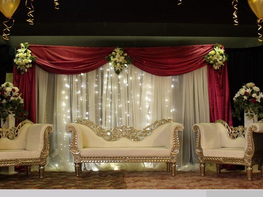 Elegant Wedding Stage Setup with Gold Furniture and Floral Decor HD wallpaper
