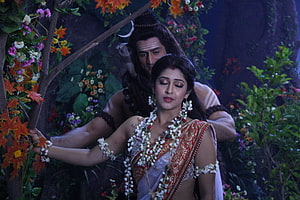 Lord Shiva and Parvati in a lush forest setting from the Mahadev TV series HD wallpaper