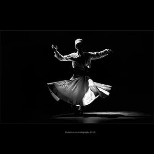 Sufi Whirling Dervish in Dramatic Black and White Stage Lighting HD phone wallpaper