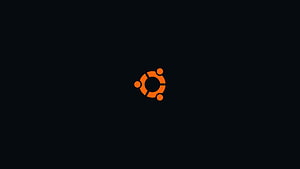 Minimalist Orange Ubuntu Logo on Dark Background HD wallpaper