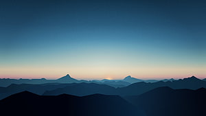 Minimalist Blue Mountain Range Silhouette at Sunset HD wallpaper