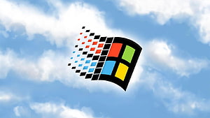 Windows 98 Classic Logo Floating Against a Bright Blue Sky With Fluffy White Clouds HD wallpaper