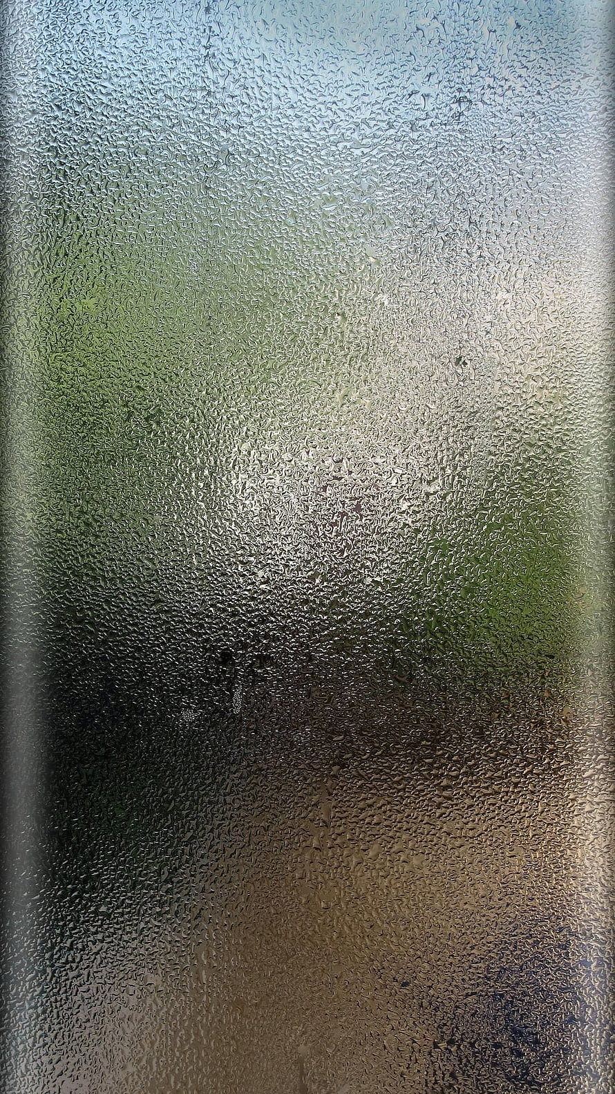 Condensation Droplets on Frosted Glass Window with Blurred Green Background HD phone wallpaper