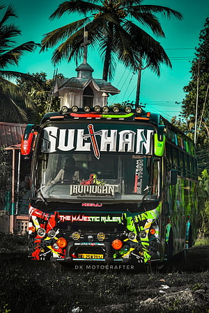 Sulthan Holidays Neeraj Bus with Vibrant Graphics and Tropical Palm Tree Backdrop HD phone wallpaper