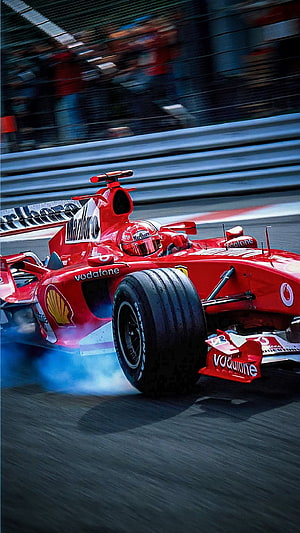 Ferrari F2004 Formula 1 Race Car with Schumacher Livery on Track HD phone wallpaper