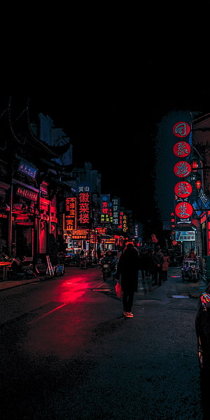 Neon-lit Chinese street at night with red lanterns and glowing signs reflecting on wet pavement HD phone wallpaper