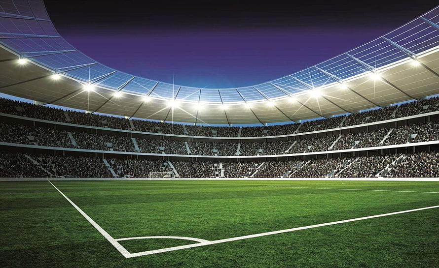 Illuminated Soccer Stadium Interior With Full Crowd And Green Pitch Under Night Sky HD wallpaper