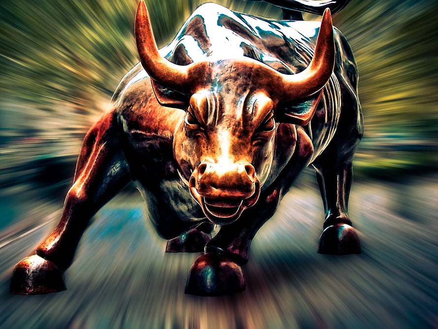 Aggressive Bronze Bull Statue with Motion Blur and Dramatic Lighting HD wallpaper