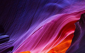 Vibrant Antelope Canyon Slot Canyon with Flowing Sandstone Walls in Purple and Orange HD wallpaper