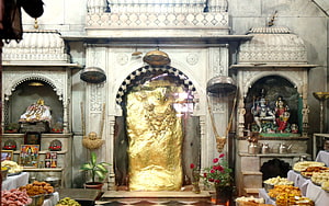Golden Nandi Bull Statue Inside Hindu Temple Shrine With Offerings HD wallpaper