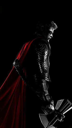 Thor God of Thunder Holding Stormbreaker Axe with Red Cape in Dark Cinematic Profile HD phone wallpaper