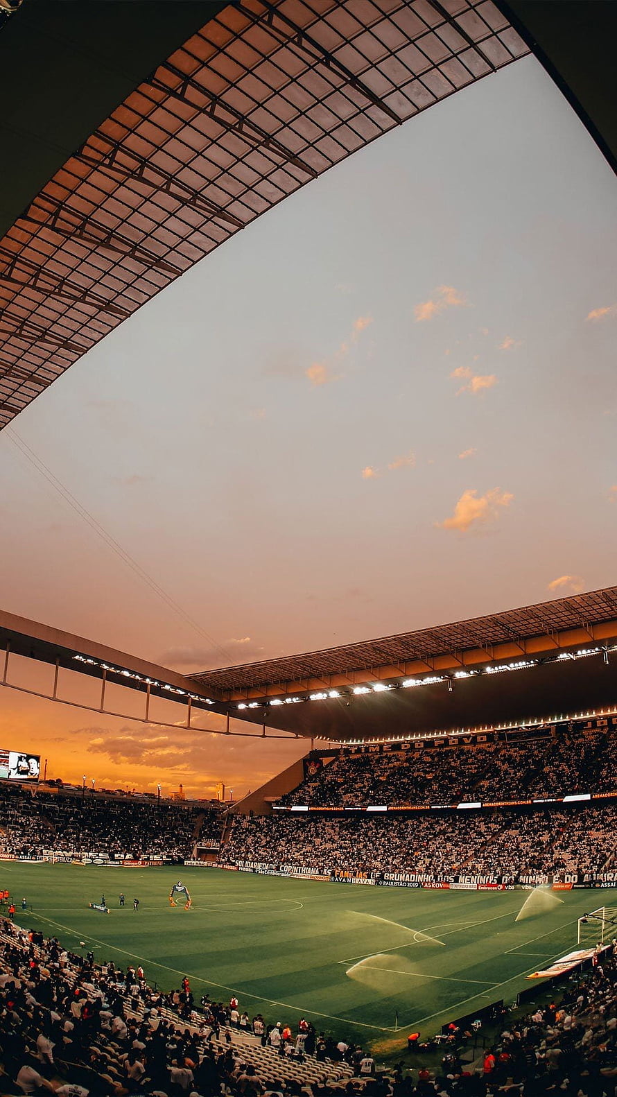 Arena Corinthians Stadium Interior at Sunset with Full Crowd and Active Pitch HD phone wallpaper