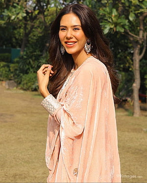 Sonam Bajwa in a Soft Blush Velvet Abaya with Ornate Jewelry in a Sunlit Garden HD phone wallpaper