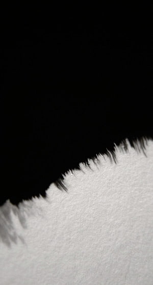 Abstract Black And White Texture With Rough Torn Edge And Grainy Paper Surface HD phone wallpaper