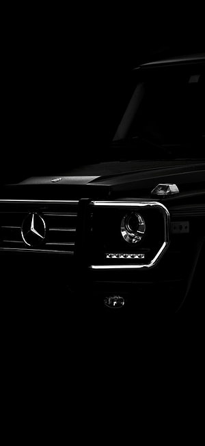 Mercedes-AMG G63 Front Grille and Headlight Detail in Dark Studio Lighting HD phone wallpaper