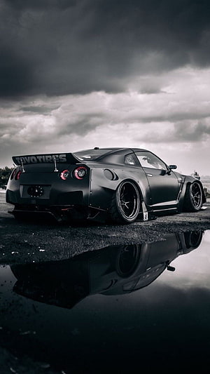 Matte Black Nissan GT-R R36 Widebody Stance Under Stormy Sky HD phone wallpaper