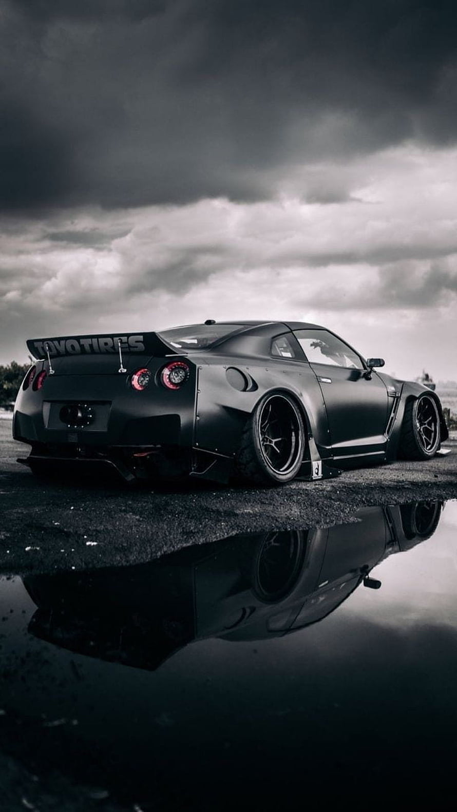 Matte Black Nissan GT-R R36 Widebody Stance Under Stormy Sky HD phone wallpaper