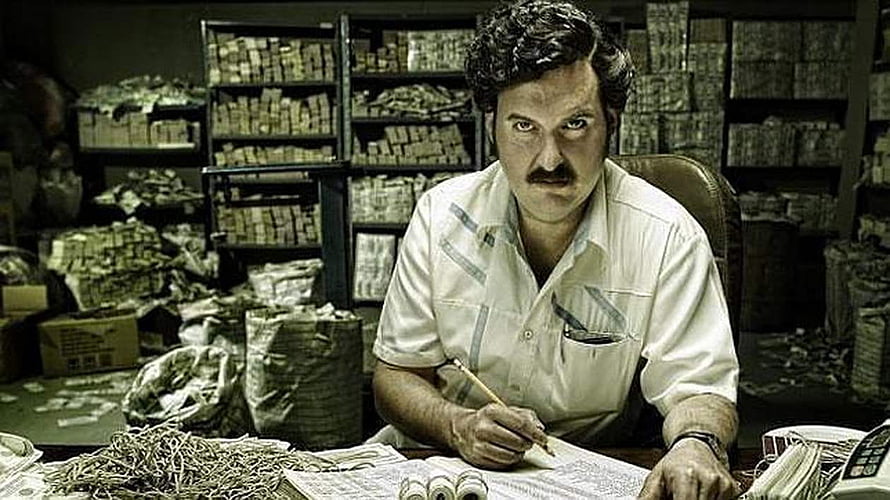Pablo Escobar Counting Stacks of Cash in a Dark Warehouse HD wallpaper